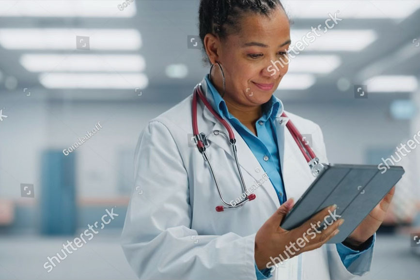 Doctor looking at a clipboard